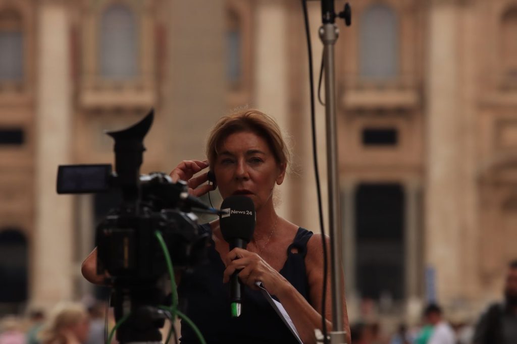 Demo Post 3 Journalist reporting live from Vatican City, capturing the essence of urban broadcast journalism.